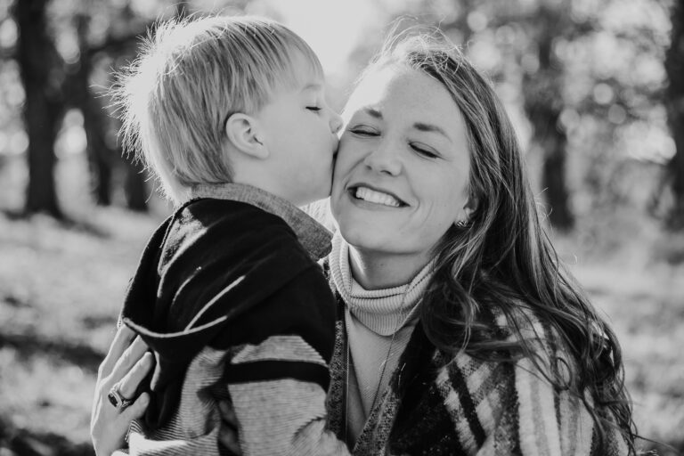 Picture of mom and son embracing and finding happiness and peace through Pathological Demand Avoidance (PDA).