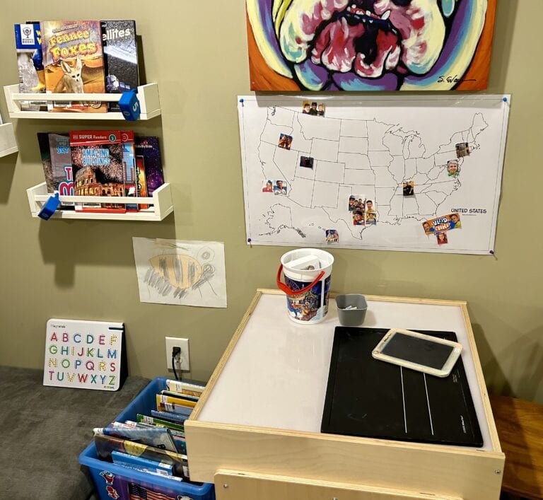 Chalkboards and chalk left out for literacy exploration 