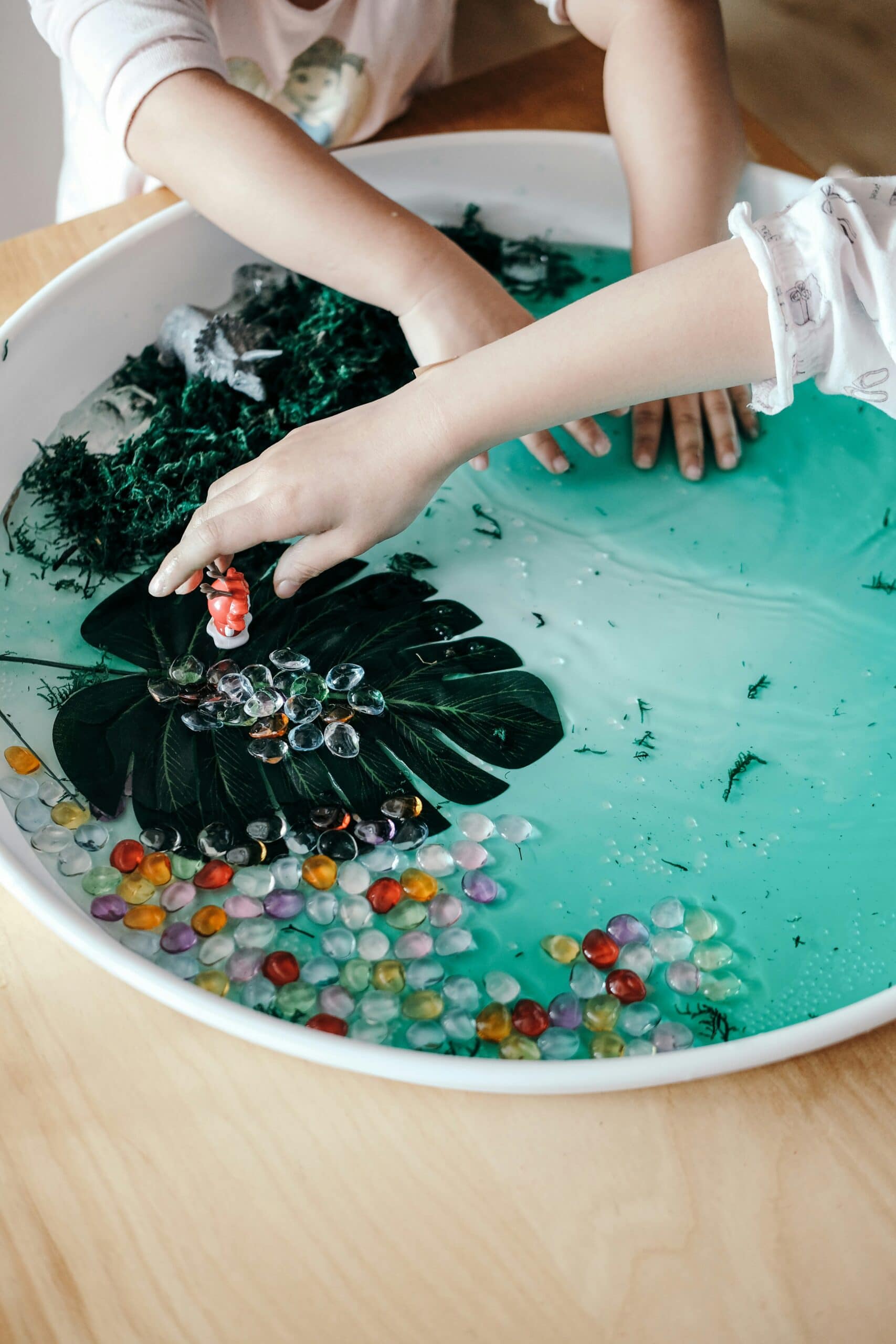 Child with water bead tray-Sensory Self-directed learning ideas